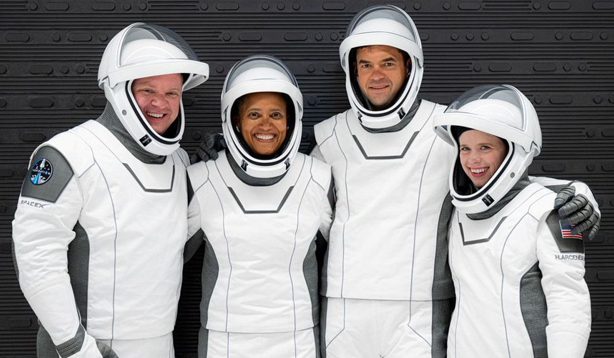 The Inspiration4 crew poses while suited up for a launch rehearsal